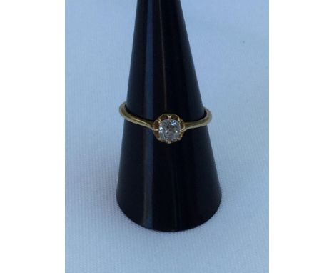 A lady's stamped 18ct yellow gold solitaire diamond ring.  The cushion cut diamonds weighs an estimated 0.50 carats. Finger s