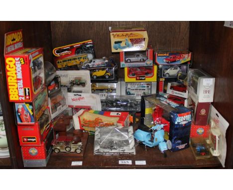 SECTIONS 37 &amp; 38.  Two shelves of toy cars including Vespas, limited edition buses, friction Benz, Burago BMW Roadster, F