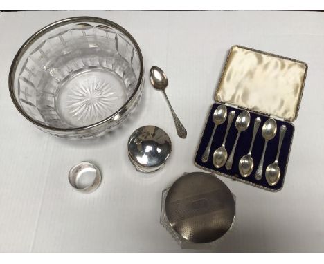 A collection of assorted silver and silver-plated wares comprising a silver-mounted bowl by Kemp Brothers, a cased set of sil