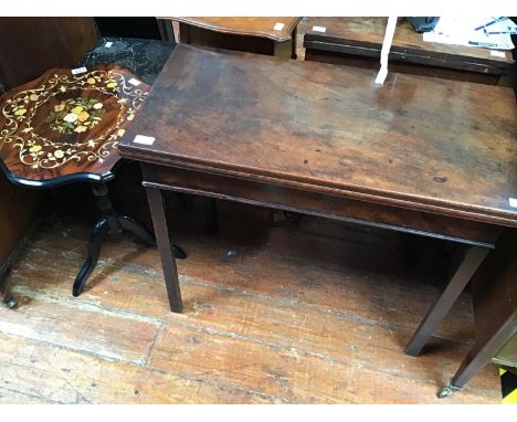 A mahogany folding tea table, raised on pentagonal supports, together with an oak 'smoker's' table with single cupboard door 