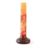 A LARGE GALLE TALL SLENDER CYLINDRICAL GLASS VASE with a flattened bulbous base, overlaid with a