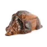 A LATE 19TH CENTURY EARTHENWARE SLIP GLAZED TUREEN modelled as a hog 44cm wide 20cm deep 18cm high