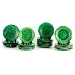 A LARGE COLLECTION OF 19TH CENTURY WEDGWOOD TYPE GREEN RELIEF MOULDED PLATES of varying size with