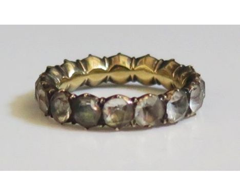 A Georgian Paste Full Eternity Ring in an unmarked gold setting, size K.5, 3g 