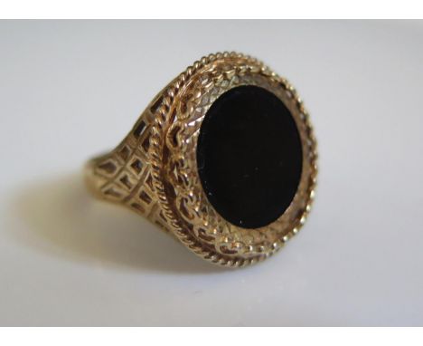 A 9ct Gold and Black Onyx Ring, 21mm diam., size O.5, 4.8g 