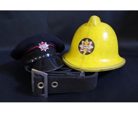An Old London Fire Brigade Helmet, cap, belt and fire extinguisher 