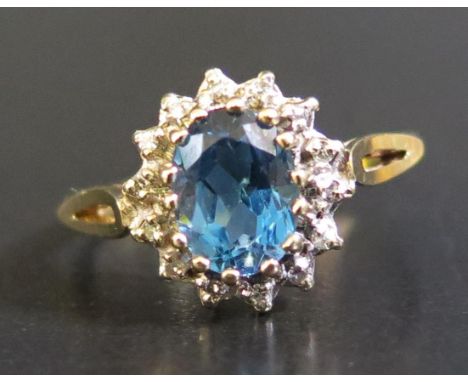 A 9ct Yellow Gold, Blue Topaz and Diamond Ring, size O.5, 2.2g 