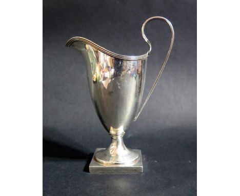 A Victorian Silver Helmet Shaped Cream Jug, Birmingham 1895, Hayes Brothers, 113g. With inscription, dent and uneven foot 