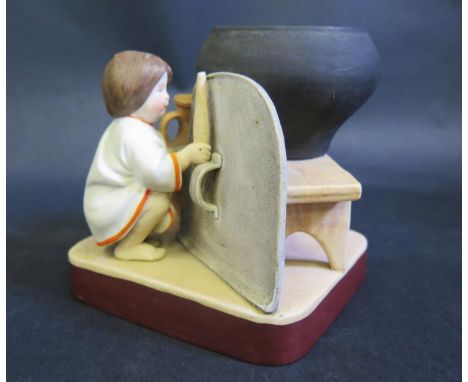 A Russian Biscuit  Figure of a Hiding Girl Holding a Rolling Pin by the Gardner Factory, c. 1890, marks to base, 12.5cm high 