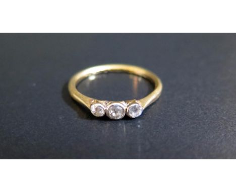 An 18ct Yellow Gold and Diamond Three Stone Ring, size N.5, 2g 