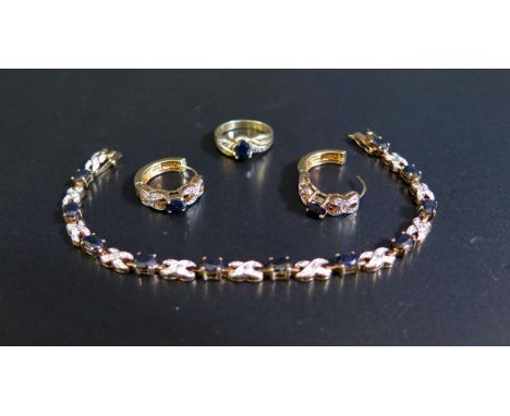 A Gold Plated Sapphire and White Stone Costume Bracelet with matching ring and earrings 