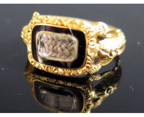 A Victorian 18ct Gold and Enamel Memorial Ring with glazed woven hair panel and inscription to the back 'W.J.M. Cunningham di