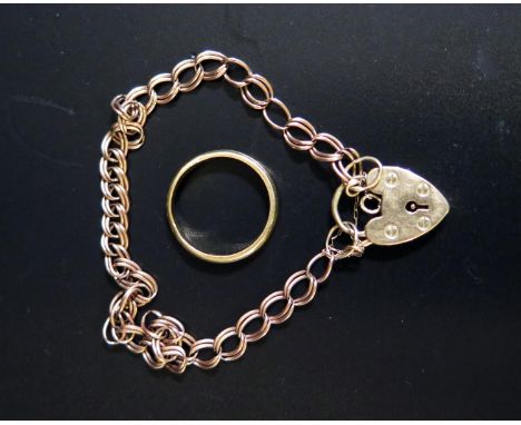 An 18ct Gold Band (size K. 2.3g) and 9ct gold bracelet 5.5g 