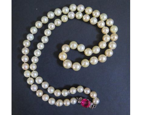 A Single Strand Graduated Pearl Necklace with a ruby and diamond set precious white metal clasp, 55cm, largest pearl 8.5mm, m