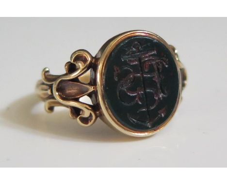 An Antique 15ct Gold and Bloodstone Ring carved with anchor and initials TS, size N, 4.2g 