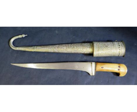 A 19th Century Middle Eastern Islamic Dagger (Kard) with brass scabbard having chased foliate decoration and inscription, bla