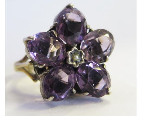 A 9ct Gold, Amethyst and Pearl Flower Head Ring, size J.5, 6.7g 