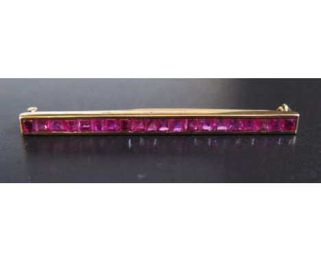 A Ruby Bar Brooch in an unmarked gold setting, 45mm, 2.5g 