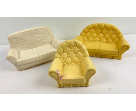 A vintage Sindy doll button backed sofa and matching armchair together with one other vintage Sindy sofa. 