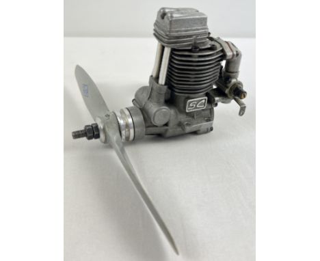 A model aircraft SC52 4 stroke glow plug engine. 