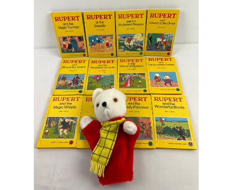 A set of 12 vintage Rupert Bear books from Sampson Low, together with a vintage Rupert Bear hand puppet toy. Books 1 - 12 fro