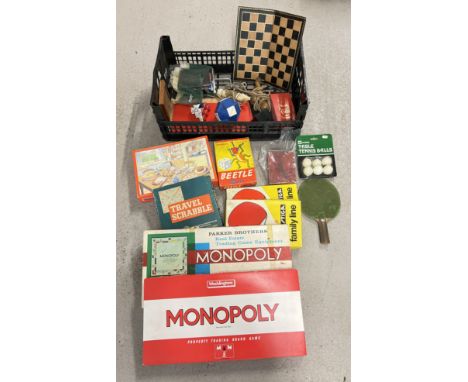 A box of assorted vintage toys, games and board games to include table tennis, Monopoly, draughts, Chess pieces, Beetle and S