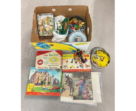 A box of assorted vintage toys, games and puzzles, to include Fuzzy Felt Circus, wooden jigsaw puzzles, boxed ceramic tea set