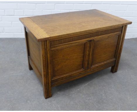 Light oak coffer of traditional design with a dentil frieze over a double panelled front, hinged lid and void interior,  48 x