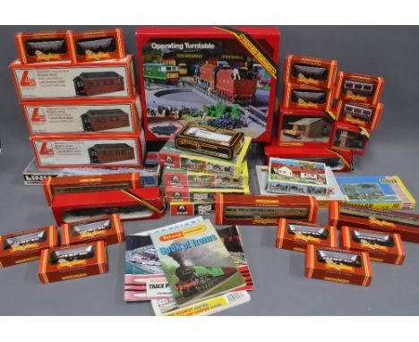 Quantity of boxed Railway sets to include Hornby 00 Gauge, Lima Engine Sheds, Heljan, Pola &amp; Faller, and a Tri-Ang Hornby
