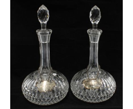 A pair of glass globe and shaft decanters and stoppers together with Port &amp; Sherry decanter labels 29cm (2) 