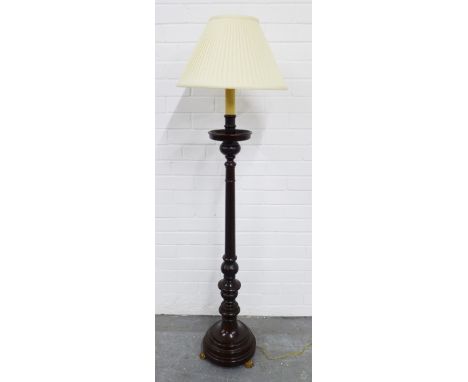 Mahogany standard lamp with brass paw feet, 150cm 