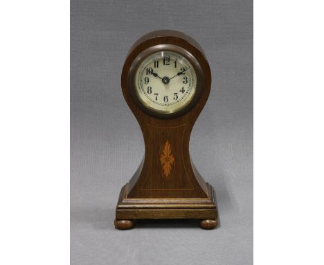 Mahogany and inlaid clock of small proportions, with Arabic numerals and raised on bun feet, 16cm 