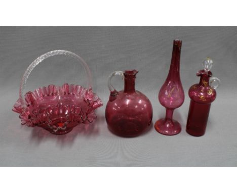 A collection of cranberry glass to include a posy basket, decanter and stopper, vase, etc, tallest 27cm (4) 