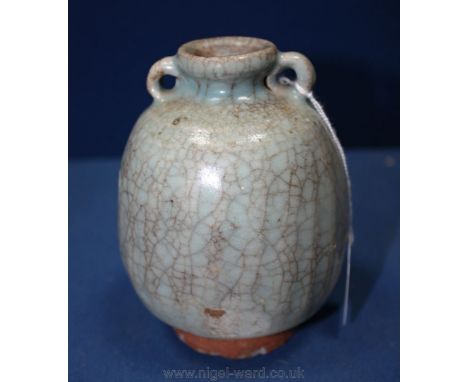 A good Chinese Song Dynasty Jartlet of Guan ware type with twin ring handles and crackle glaze, the foot fired red as in the 