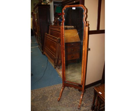 A late 19th c. Mahogany Cheval Mirror, with rectangular, ornate shaped top mirror in finial mounted square supports and on sp