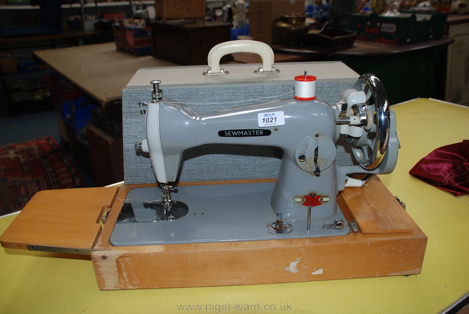 A cased Sewmaster Deluxe hand Sewing machine.