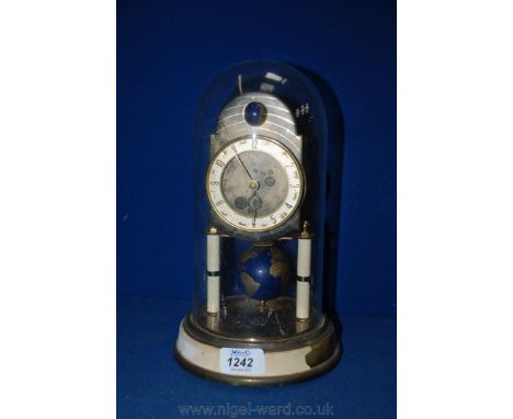 An Anniversary Clock with a revolving globe Pendulum and a stylised orbital moon roller.