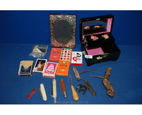 A box of playing cards, penknives and musical box, etc.