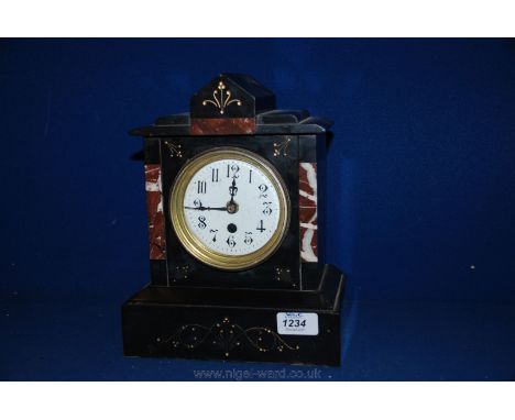 A black Slate and Marble Mantle Clock, movement and pendulum present but converted to battery operated, 11" tall.