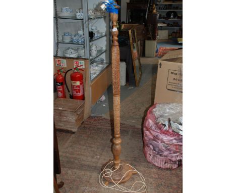 A heavily carved Indonesian wooden Standard Lamp base.