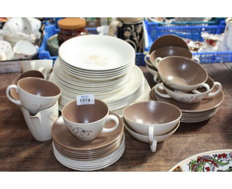 A Poole Dinner and Tea Service in a brown, cream and floral pattern including large meat plate, six each dinner and side plat