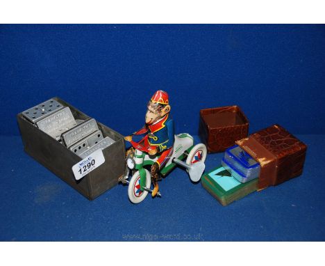 A set of metal covered Dominoes advertising Franklyns, a tin plate Monkey on a bike, Shag Tobacco with vintage leather case c