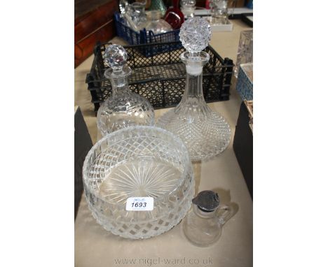 A large glass trifle Dish, a heavy glass Decanter, a cut glass decanter and a silver topped jug