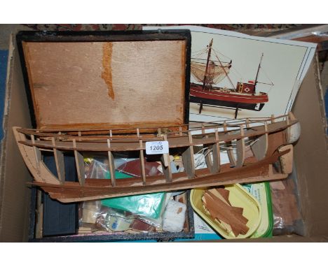 A Billings Krabbencutter Boat (unfinished), plans, deck parts, planking and modelling tools.