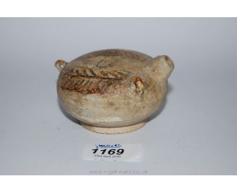 A delicate and attractive Khmer or early Thai brown glazed miniature kendi, 13th-14th century, with three handles and spout. 