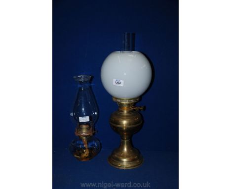 A twin burner Oil Lamp with globe shape and another.