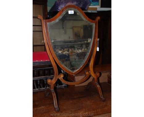 A 19th c. Mahogany shield shaped Dressing Mirror on scrolled legs with cross banding and inlaid roundels.