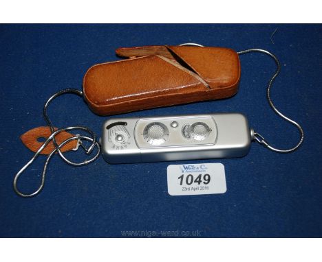 A Minox 1959 model B Spy Camera with carry case and lanyard.