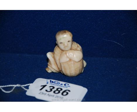 A small Japanese Meiji period (1860) one piece carved Ivory Netsuke of a man with a basket.