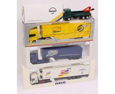 Diecast: A collection of four various boxed diecast commercial vehicles to include: MAN, Iveco, Boots and one other. Vehicles